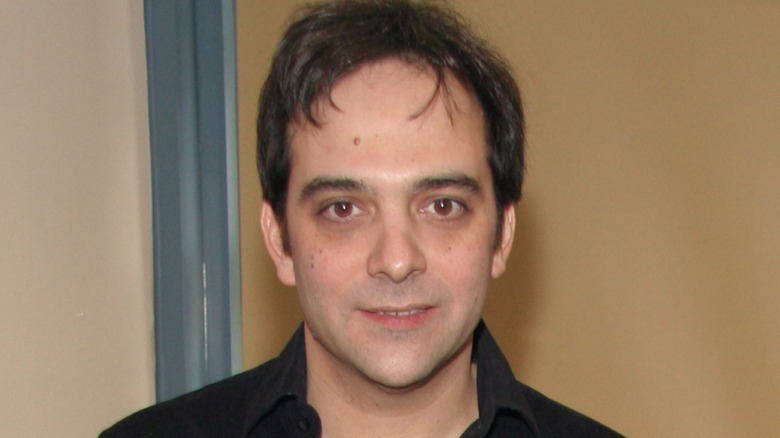 Adam Schlesinger smiling faintly