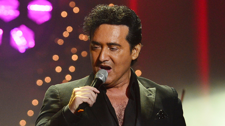 Carlos Marin sings on stage