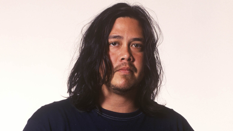 Chi Cheng of Deftones posing for publicity photo