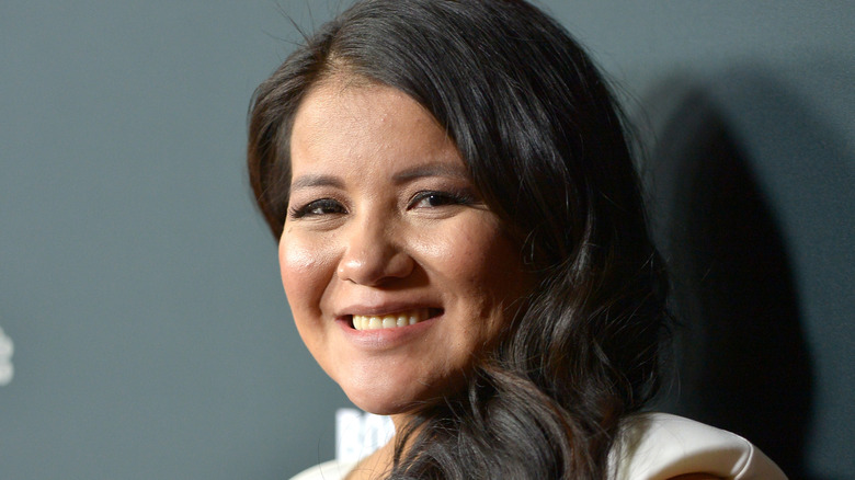 Misty Upham turned and smiling at camera
