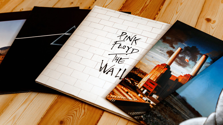 Five Pink Floyd albums on wooden surface