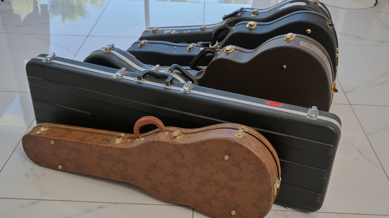 A lineup of guitar cases