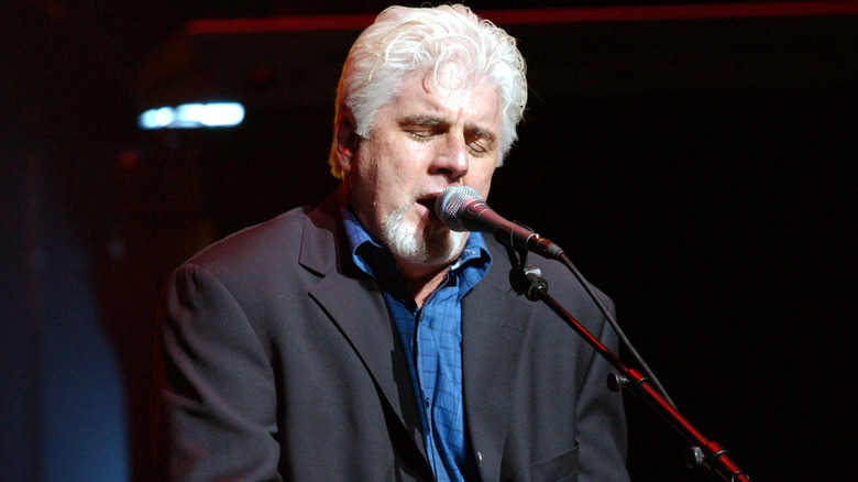 Michael McDonald singing and playing keyboards with eyes closed