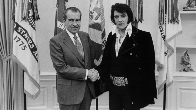 Richard Nixon shaking hands with Elvis Presley