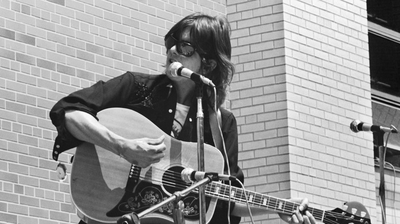 Gram Parsons performing on stage