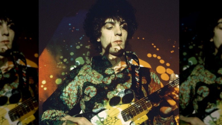 Syd Barrett playing guitar