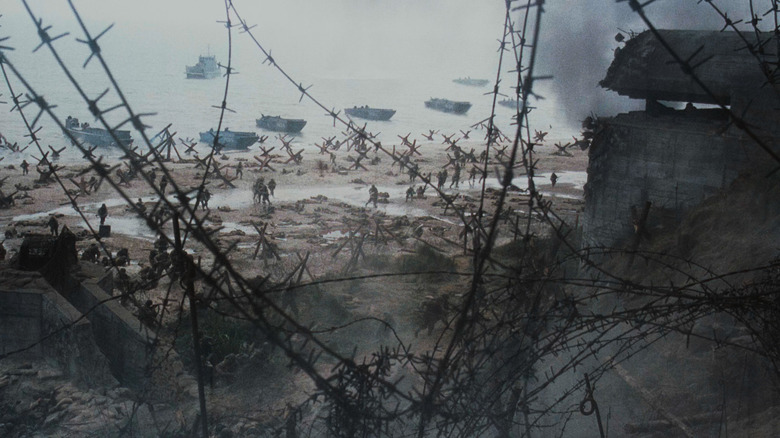 View of Omaha Beach and Allied forces through barbed wire, Saving Private Ryan