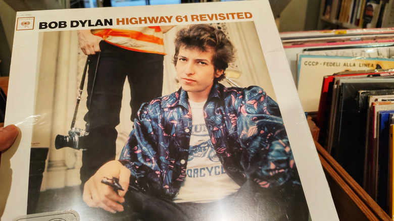 Bob Dylan's album "Highway 61 Revisited" is held in a record store