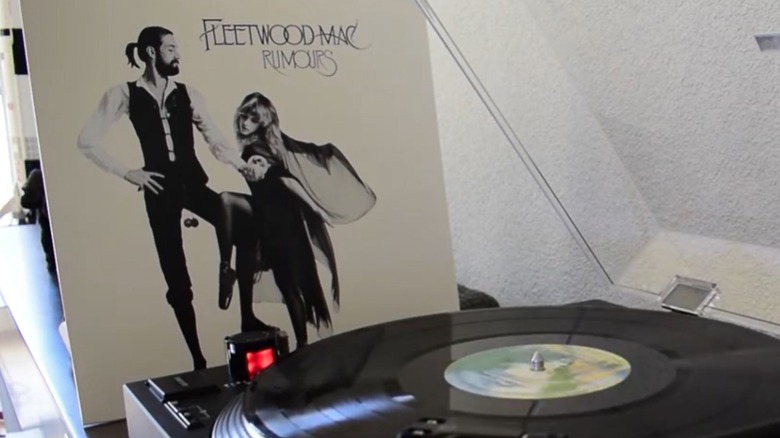 front cover of the Fleetwood Mac "Rumours" album beside vinyl player