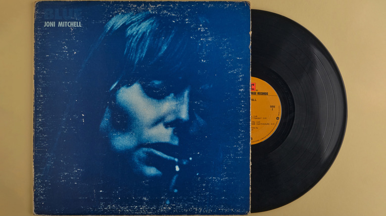 Blue record pulled from sleeve