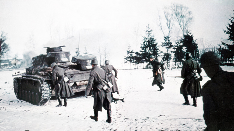 A Panzer tank and soldiers during a later stage of Operation Barbarossa