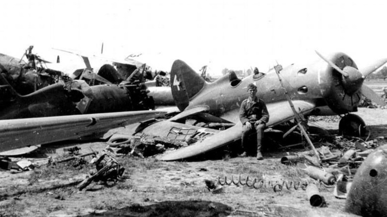 Soldier sitting on a bombed plane