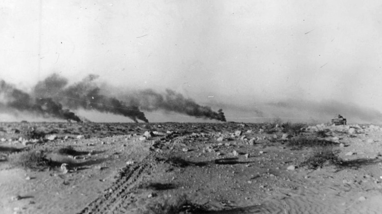 Smoke rising from a battlefield in the North African desert