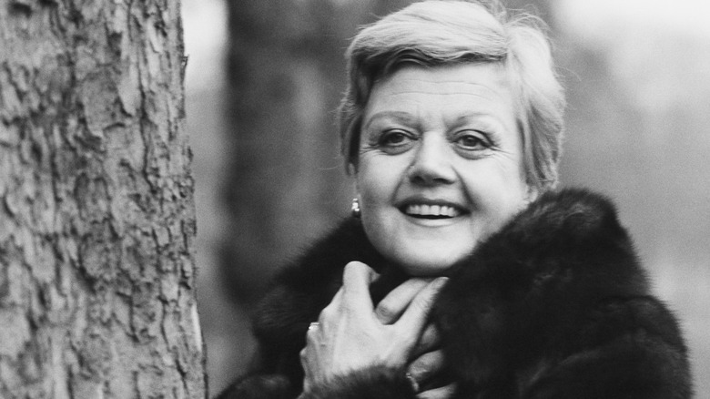 Angela Lansbury bundles up with a fur coat