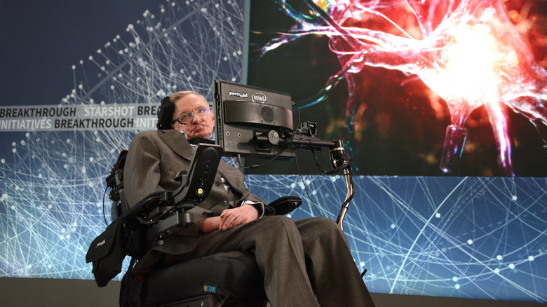 Stephen Hawking speaking onstage at a science confrence