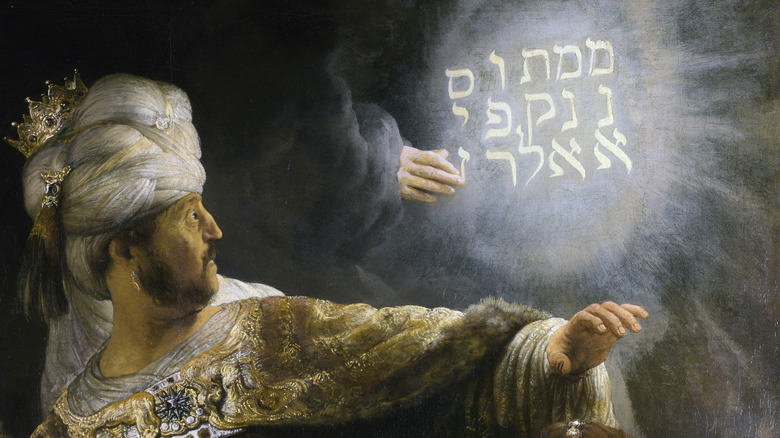 Rembrandt's oil painting of the hand writing on the wall