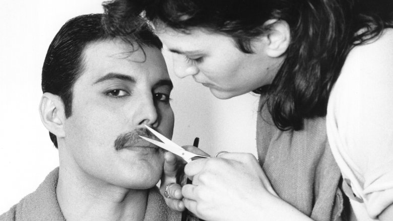 Freddie Mercury gets his mustache trimmed