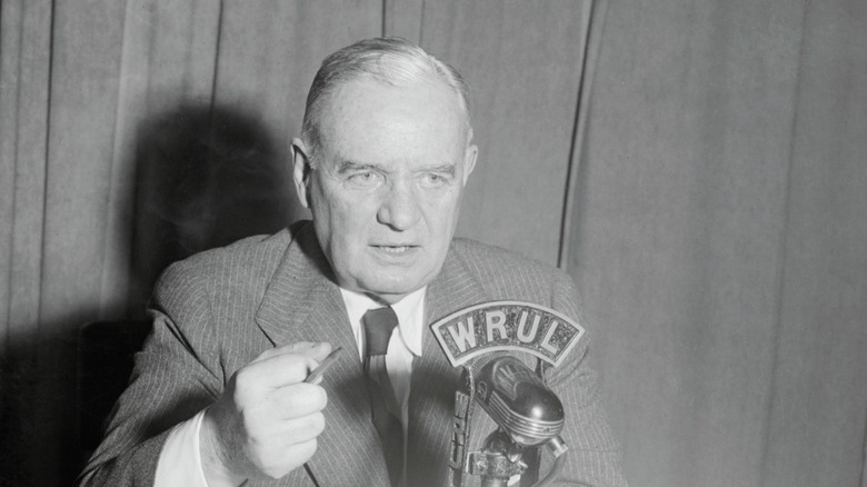 Wild Bill speaking into microphone
