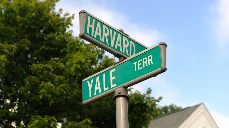 Road signs for Harvard and Yale