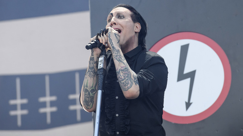 Marilyn Manson singing on stage at the 2018 Download Festival