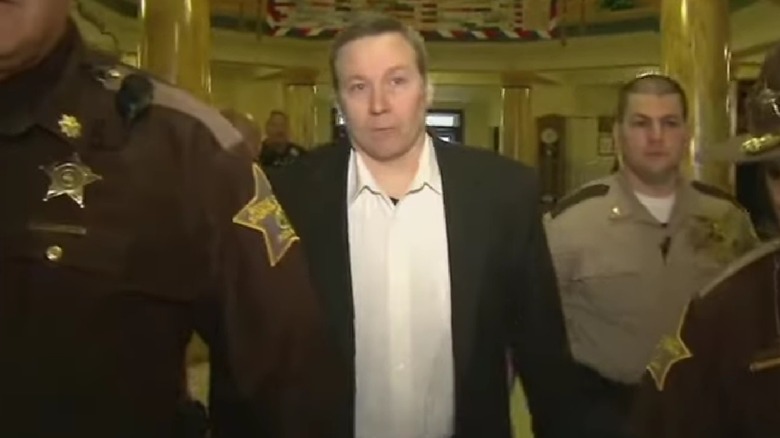 David Camm being led into court by officers