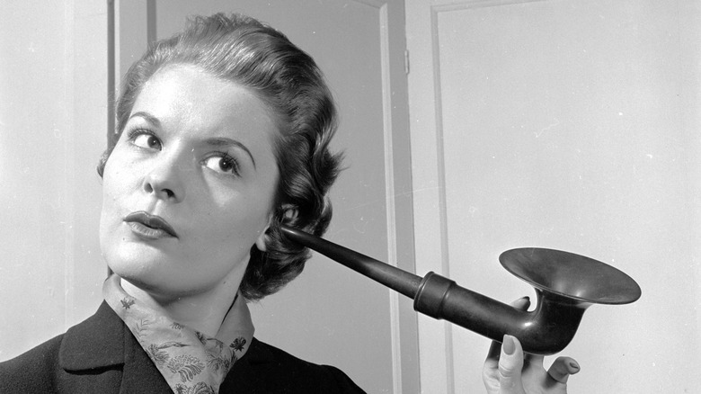 woman with ear trumpet black and white