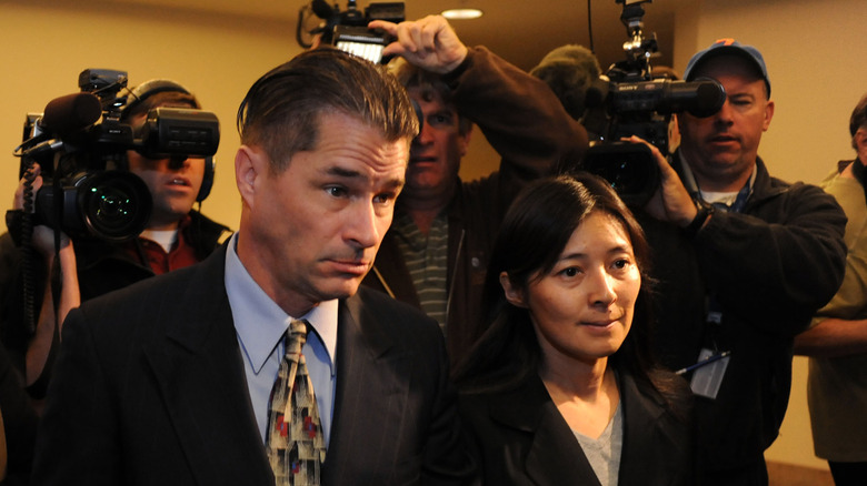 Richard Heene and his wife, Mayumi Heene surrounded by members of media after they entered their guilty pleas.