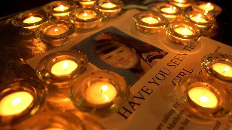 Candles lay next to a picture of missing 9-year old Shannon Matthews, 2008