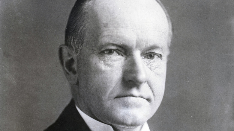 Calvin Coolidge facing camera stern
