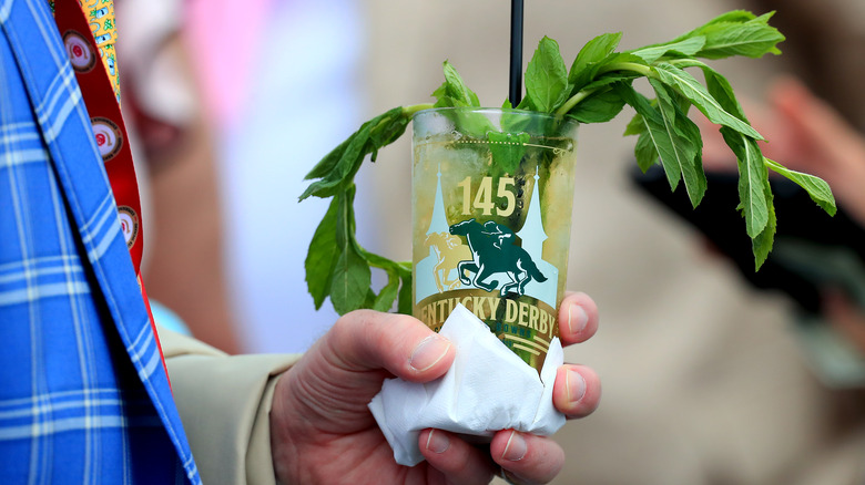 A mint julep held in hand