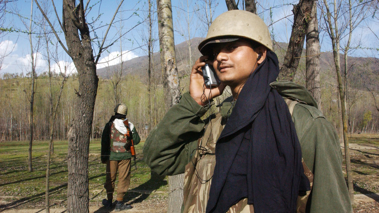 india border guard listening to radio