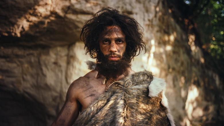 handsome caveman stock image