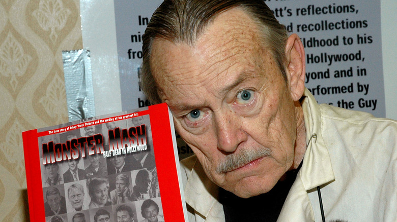 Bobby "Boris" Pickett poses with a copy of his Biography