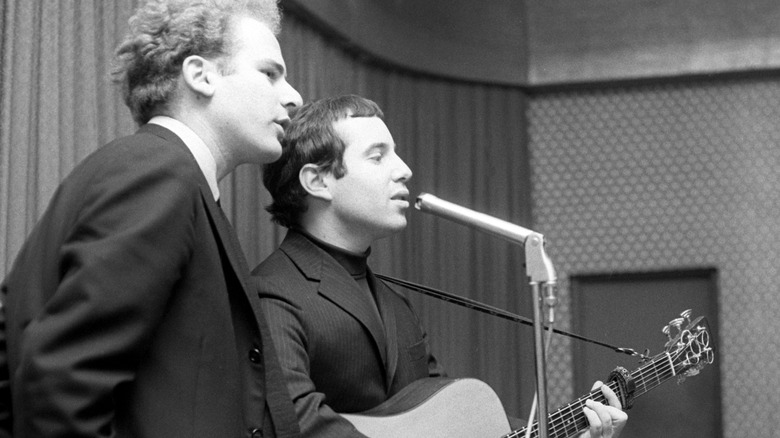 Art Garfunkel and Paul Simon singing in a studio