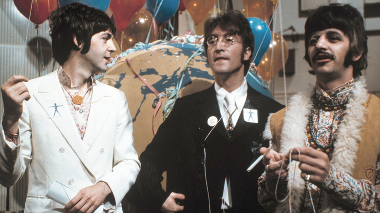 Paul McCartney, John Lennon, Ringo Starr and some balloons in the late 1960s