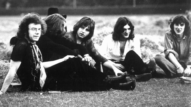 Black and white photo of King Crimson in a field