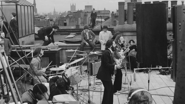 The Beatles performing on the rooftop of the Apple Corps building