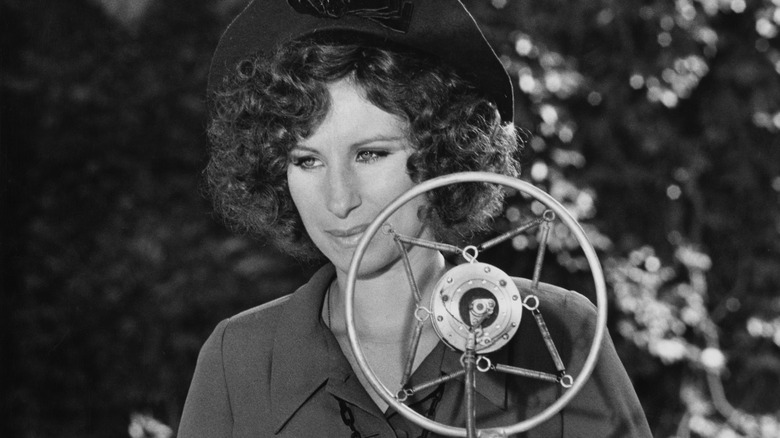 Barbara Streisand looking serious in the movie The Way We Were