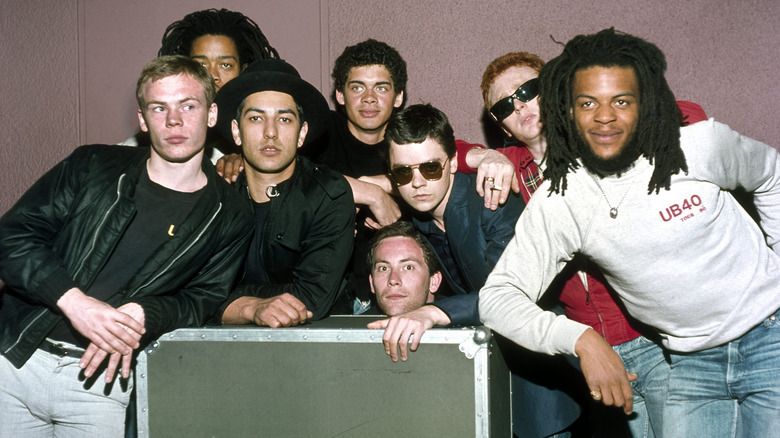 The members of the band UB40 posing backstage.