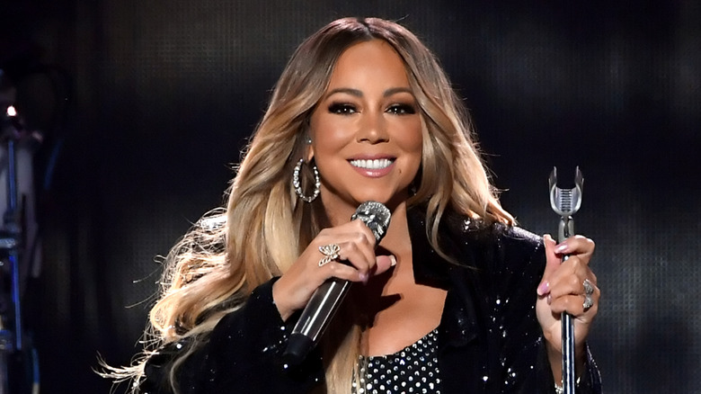 Mariah Carey smiling onstage