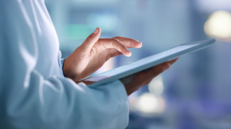 Scientist using tablet computer