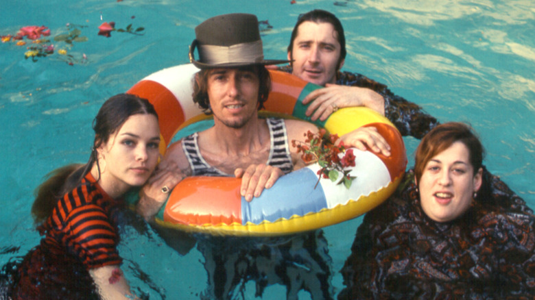 Mamas and the Papas floating in pool in publicity photo