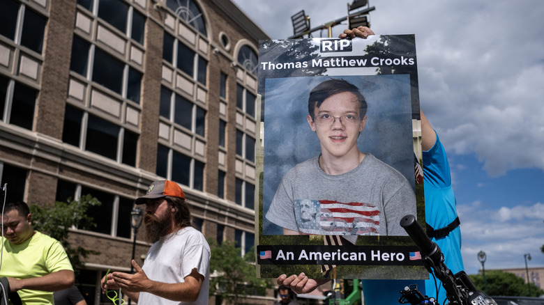 Placard of Thomas Crooks at rally hailing him as a hero
