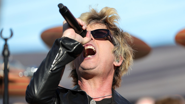Billie Joe Armstrong of Green Day singing loudly onstage