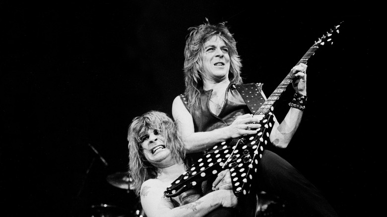 Ozzy Osbourne picking up Randy Rhoads while performing on stage