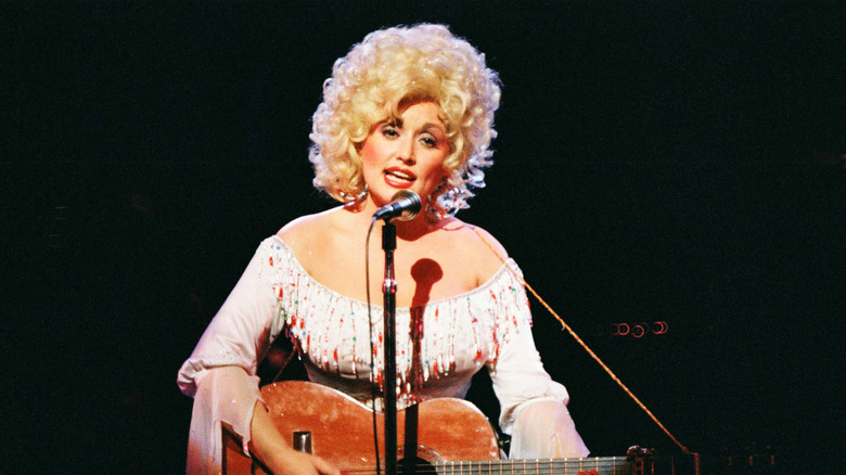 Dolly Parton sings and plays guitar in London, 1983