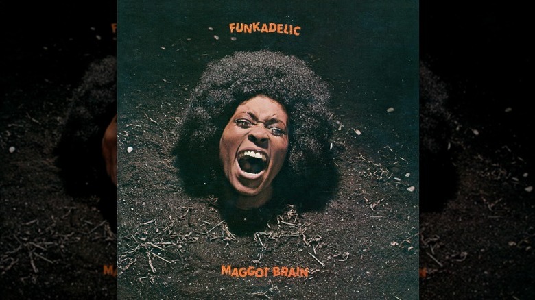 Cover art for Funkadelic by Maggot Brain, depicting a woman's screaming head protruding from mud