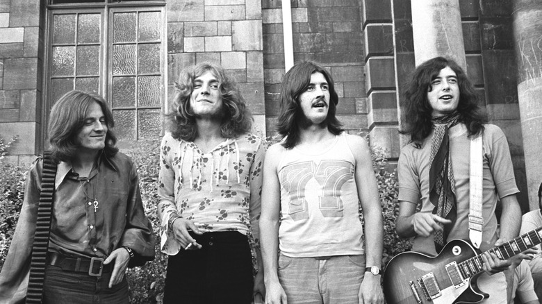 Led Zeppelin standing outdoors