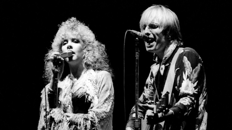 Stevie Nicks and Tom Petty performing on stage
