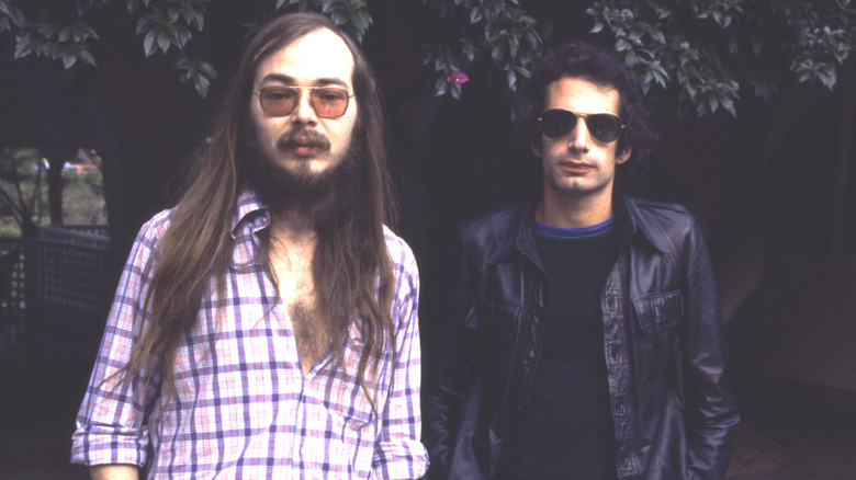 Steely Dan staring ahead in sunglasses for promo shot in 1977